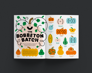 Open magazine showing illustrations of pumpkins and gourds with text on a dark background