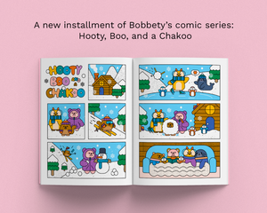 An open comic book displaying six winter cartoon panels with three cute animal characters in a snowy outdoor scene and cozy indoor scenes, set against a solid pink background with text at the top reading 'A new installment of Bobbety's comic series: Hooty, Boo, and a Chakoo'.