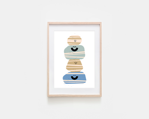 A framed art print featuring a minimalist illustration of four stacked, striped, smiling shapes in beige, light blue, tan, and blue, set in a light wood frame against a white background.
