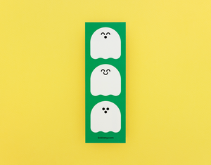 Three cartoon ghosts on a green bookmark with a yellow background
