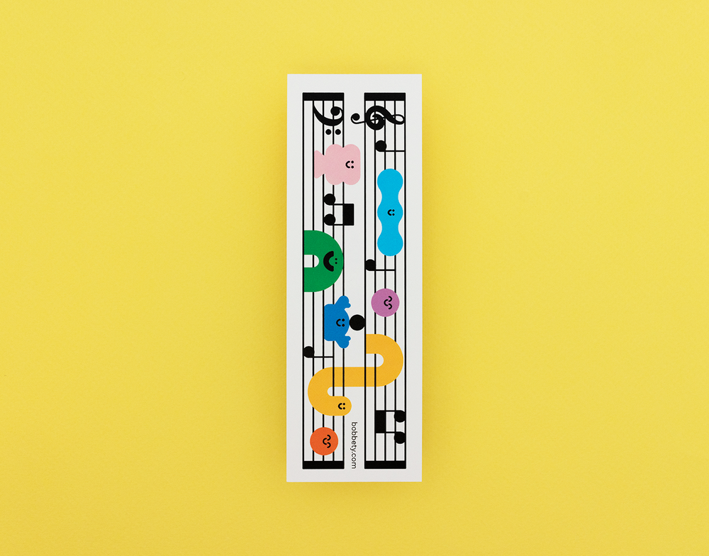 Bookmark with singing cartoon characters with 'BOBBETY' branding on a yellow background