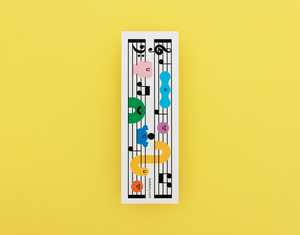 Bookmark with music sheet with colorful notes on a yellow background