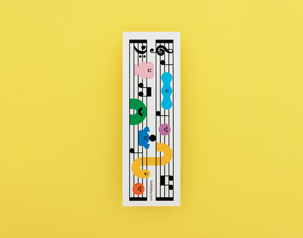 Bookmark with music sheet with colorful notes on a yellow background