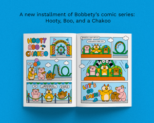 An open comic book spread titled 'Hooty Boo and Chakko' on a bright blue background, with promotional text above reading 'A new installment of Bobbty's comic series: Hooty, Boo, and a Chakoo.' The comic pages feature colorful cartoon animals and carnival-themed panels.