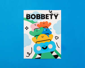 Magazine cover titled 'Bobbety' with colorful character illustration on a blue background