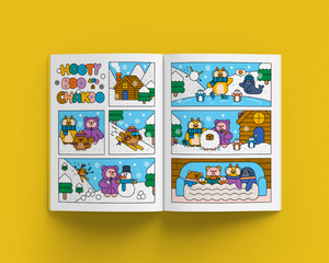 Open magazine with comic strip featuring animals in a winter setting on a yellow background