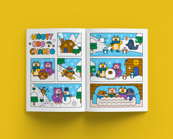 Open magazine with comic strip featuring animals in a winter setting on a yellow background