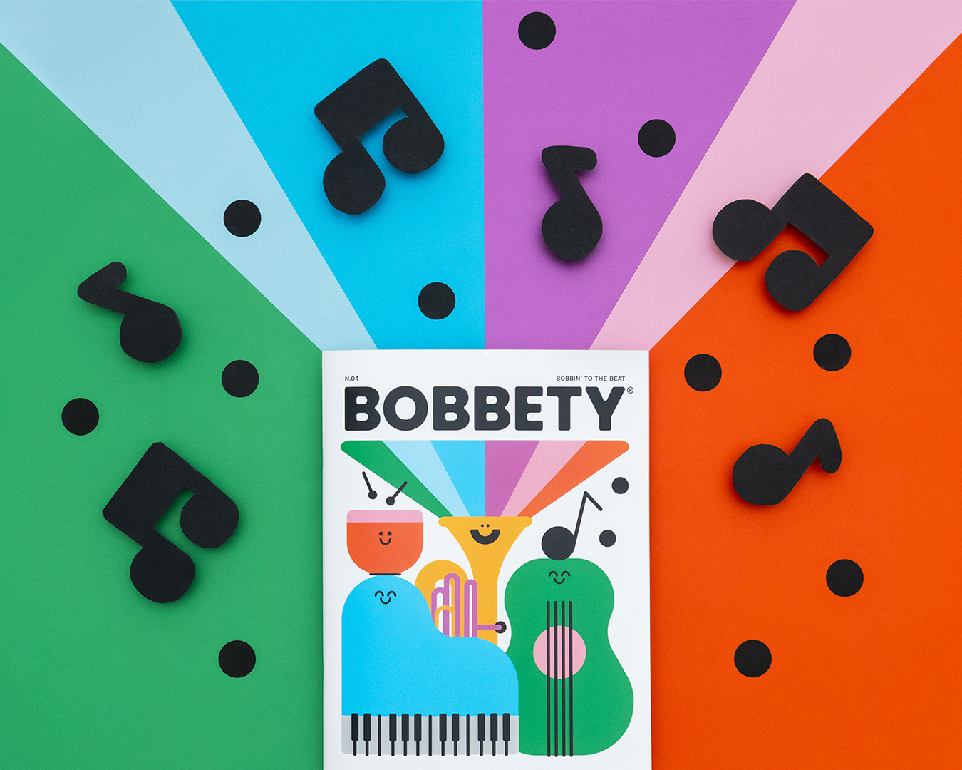 Bobbety Magazine Issue #4 cover with colorful abstract design and black musical notes on a multicolored background