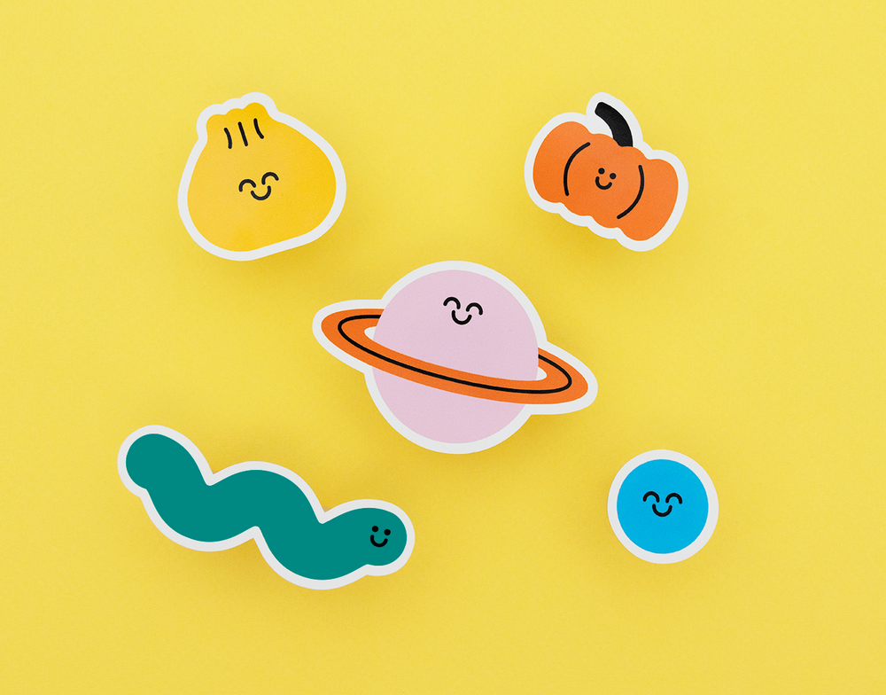 Colorful cartoon stickers on a yellow background